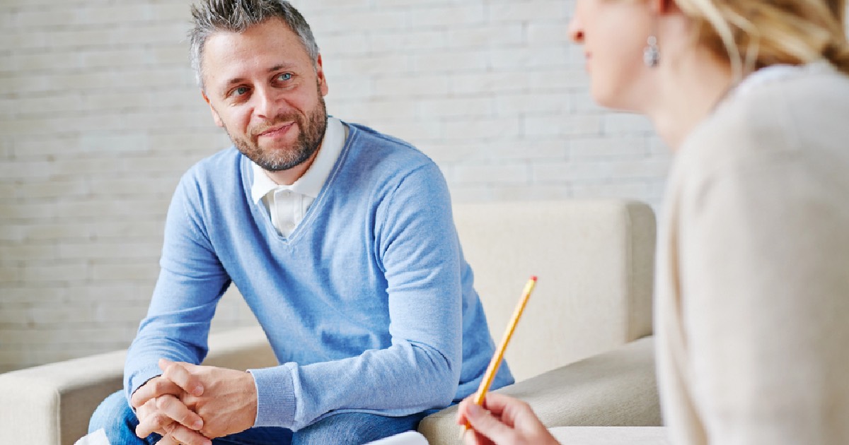 Man speaking to a therapist about his mental health 