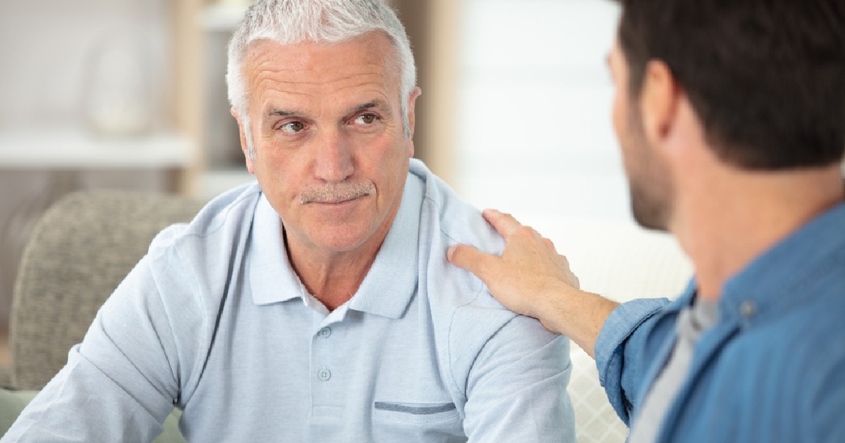 Two men discussing drug dependence