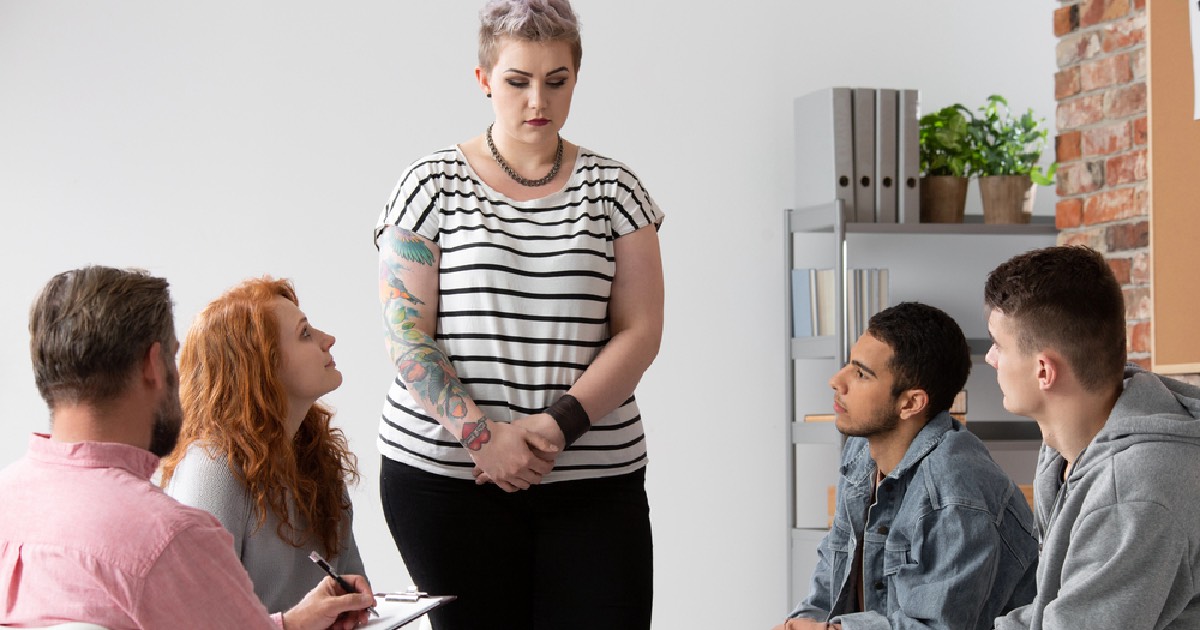 Woman Sharing During a Support Group 