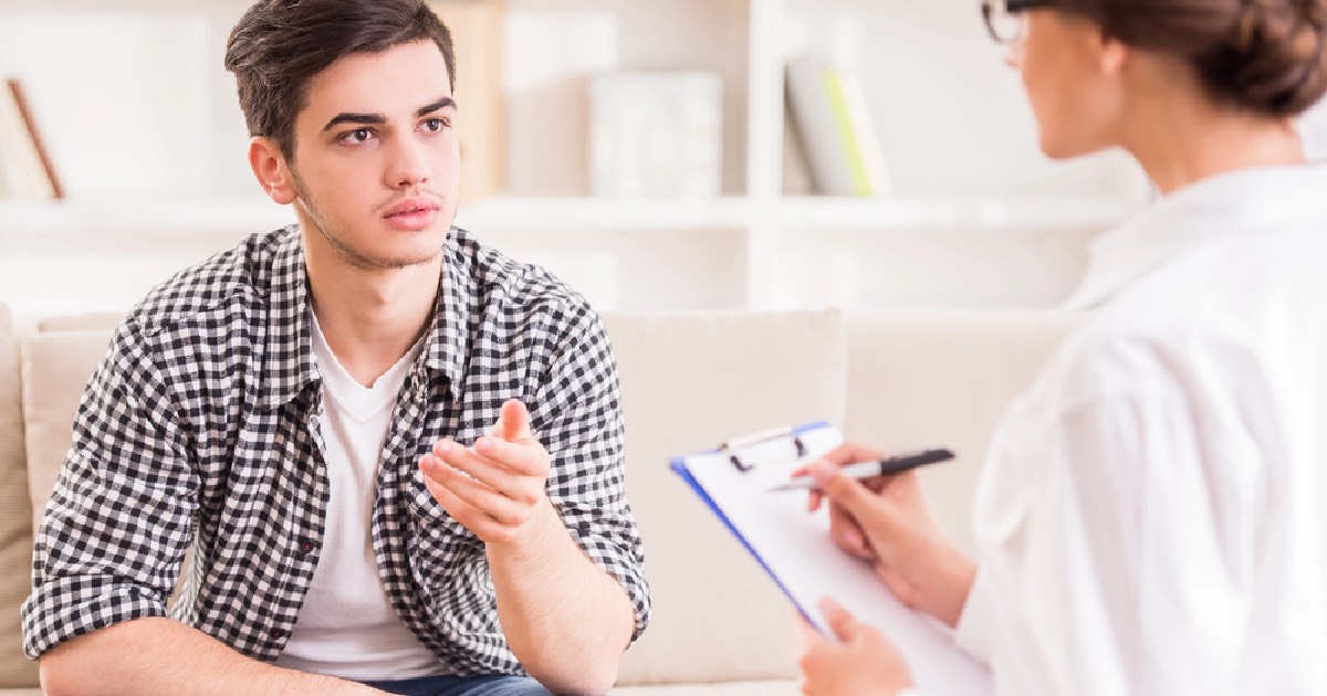 Young man having a conversation with his doctor