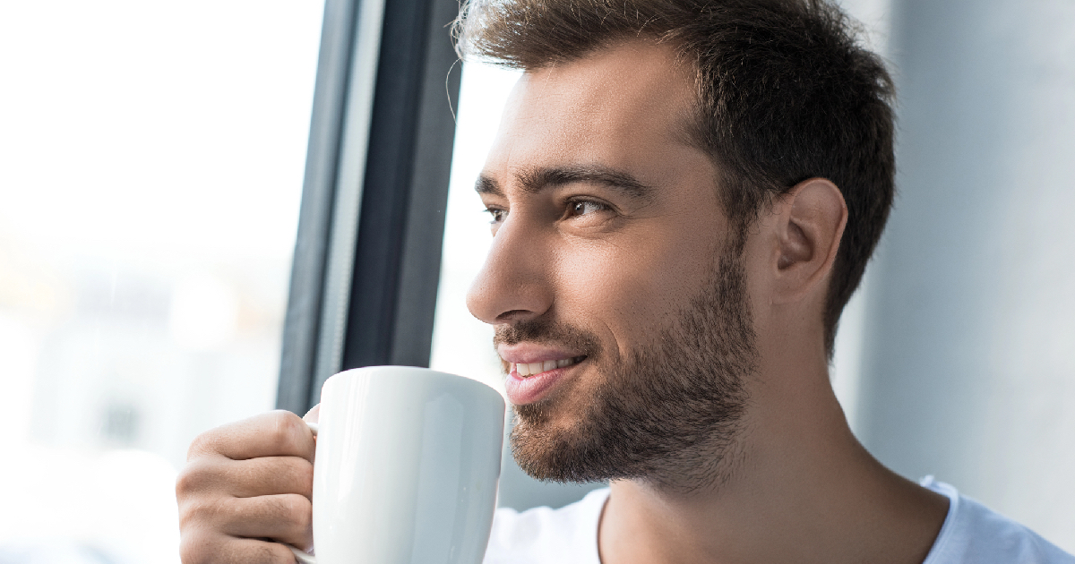 Man sipping on his coffee