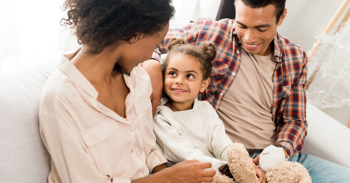 Happy family sitting at home