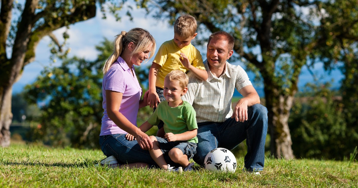 Happy family playing sports