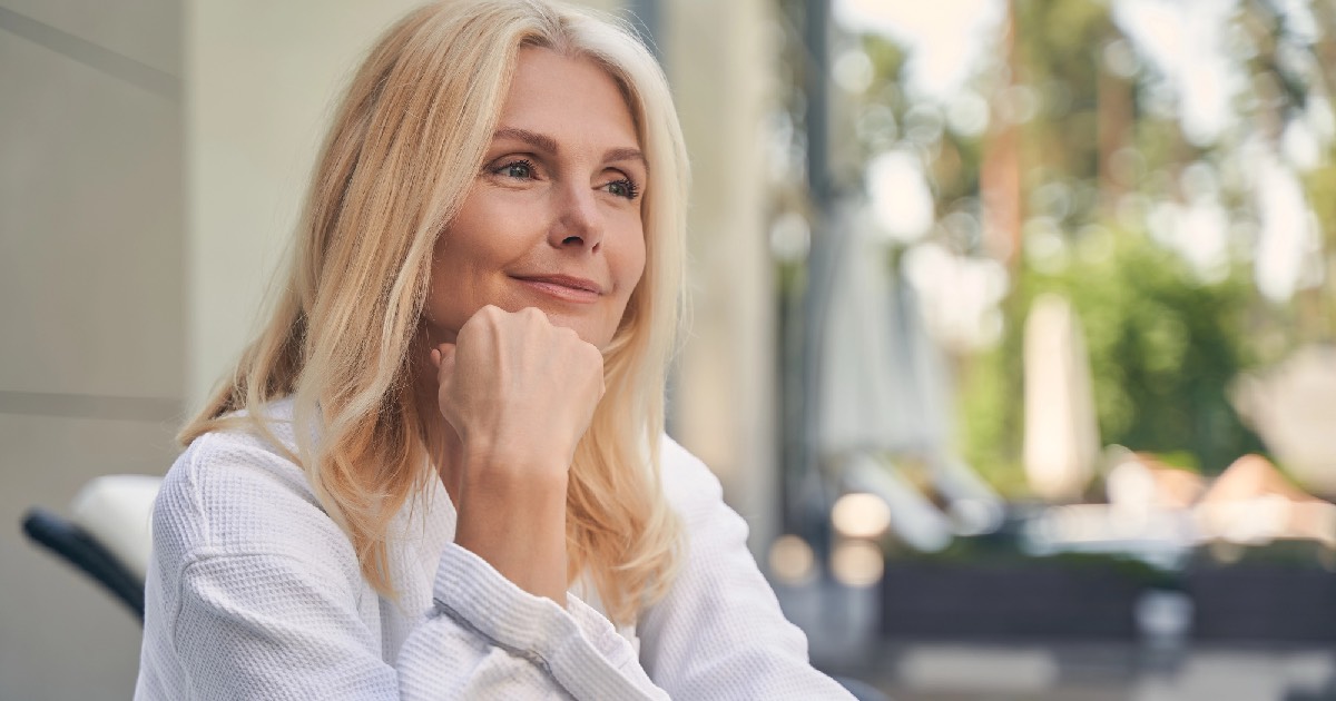 Woman sitting and smiling 